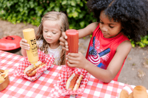 two children making hotdogs